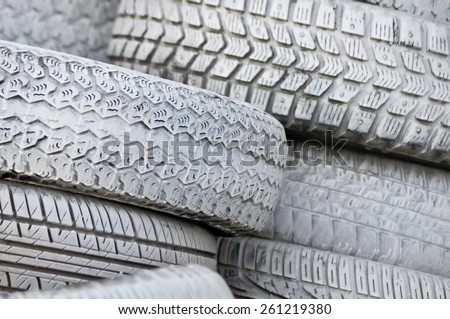 close-up. the white automobile tires dumped in a a big pile