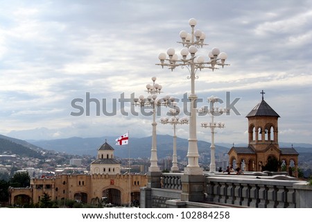 Tbilisi panorama with georgian flag