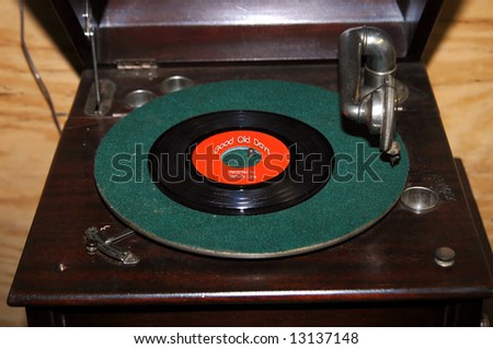 Memories and memorabilia are reflected in the label of this record on an old fashioned record player. Photographer added \
