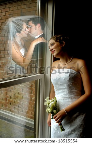 Bride leans against window.  She is dreaming of when she says \