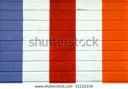 Background image is wooden wall painted in white, blue, red and yellow stripes.  Vivid and very colorful.