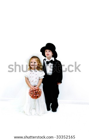 stock photo Small girl and boy dress in wedding gown and tuxedo She is
