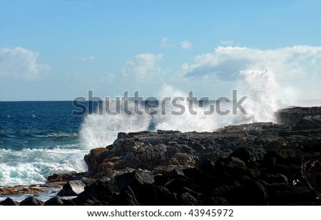 Exploring the windward side of the Big Island of Hawaii will leads you to the Kapoho Coast where waves splash and crash against the rocky cliffs.