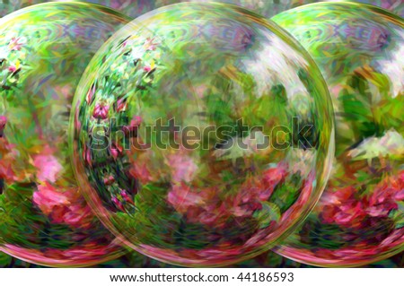 Beauty lies in the garden looking glass.  Three orbs distort yet do not block the beauty of the flower garden in all its iredescent beauty.