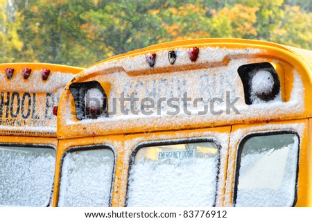 Snow flakes cling to school bus windows in Upper Peninsula, Michigan, Light frosting signaling the beginning of Winter.