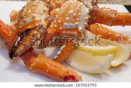 Alaskan King Crab claw with lemons.