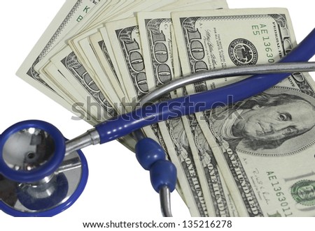 A Doctors stethoscope and one hundred dollar bills used to illustrate the expense of medical care