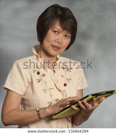 Asian woman portrait with computer tablet
