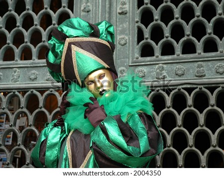 A party goer stands in front of  St Marks church in St Marks square Venice,Italy to celebrate Carnivale,the original Mardi Gras.