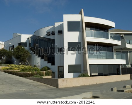 Ultra modern contemporary white house with balconies and landscaping