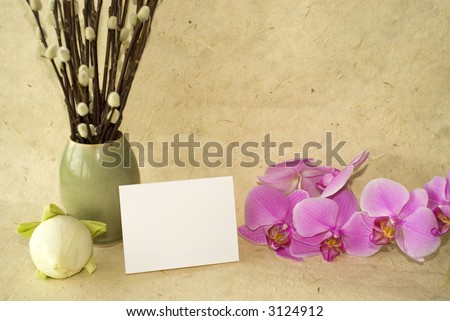 lotus flower bulbs on handmade paper with blank card for text and orchid flowers