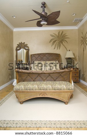 upscale tropical decor bedroom with wicker furniture