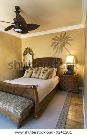 bedroom decorated in tropical style with ceiling fan