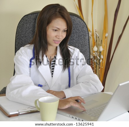 Smiling and confident female Asian Doctor.