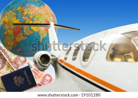 Jet plane with globe and passport with currency in background