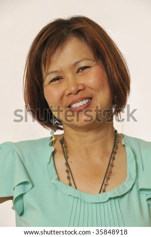 stock photo Mature Asian woman looking at camera