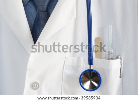 close up of Doctors coat with stethoscope,pen,syringe,and tongue depressor