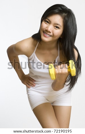 stock photo Attractive young Asian girl working out with weights