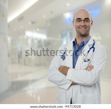 Confident Doctor standing in hospital hallway