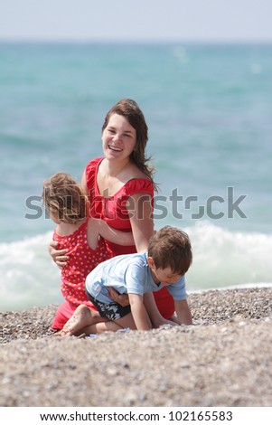 mother and two children on sea background