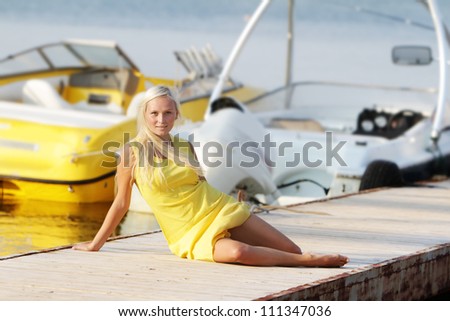 young happy beautiful woman on sea and boat background