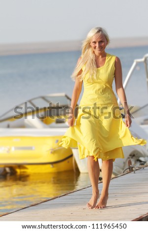 young happy woman on sea boats background
