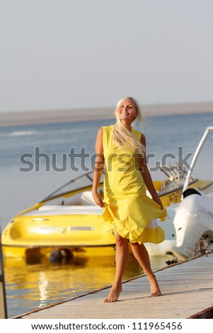 young happy woman on boats background