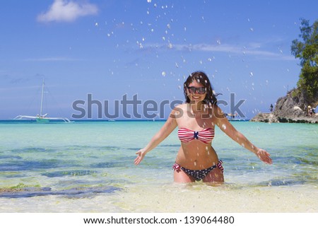 young beautiful happy woman on tropical beach and sea background
