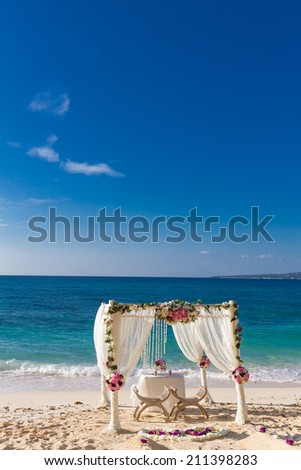 beach wedding set up, tropical outdoor wedding reception, beautiful cabana, wedding arch