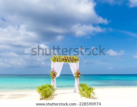 wedding arch and set up on beach, tropical outdoor wedding cabana on beach