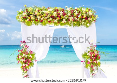 wedding arch and set up on beach, tropical outdoor wedding cabana on beach