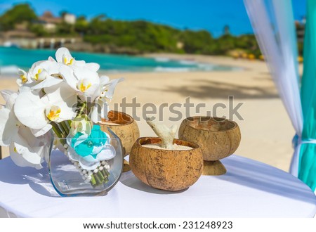beautiful wedding arch on tropical sand beach, outdoor beach wedding set up