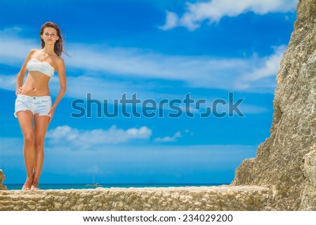 young happy beautiful woman outdoor portrait, beach and sky background