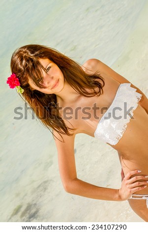 young happy beautiful woman outdoor portrait, tropical sand beach and sky background