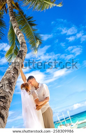 young loving couple on beach background, wedding day, outdoor beach wedding