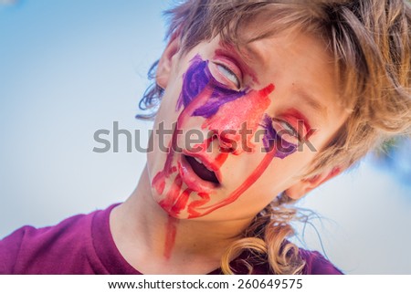 young kid - boy - with painted face, child zombie face art