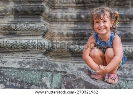young happy child girl, smiling portrait, angkor wat, cambodia