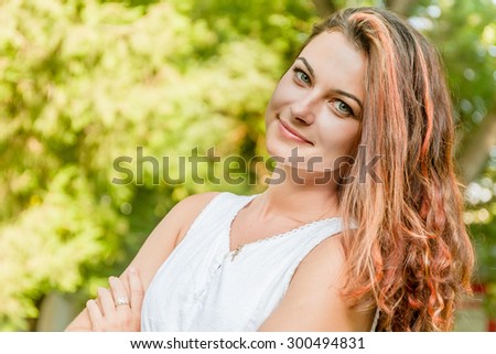 young happy woman on natural green background, smiling happy girl outdoor portrait