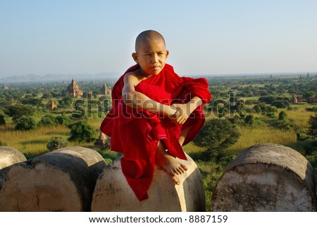 young buddhist monk on temple background