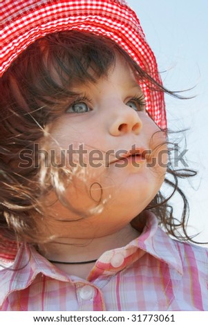 cute girl in red panama outdoor portrait