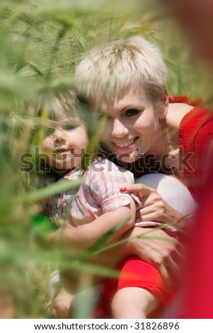 happy mother and daughter on natural background