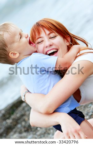 happy mother and son on natural background