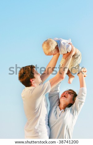 happy family isolated over blue sky