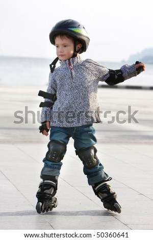 outdoor portrait of young boy in roller blades
