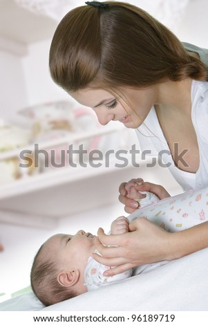 happy mother and baby at home