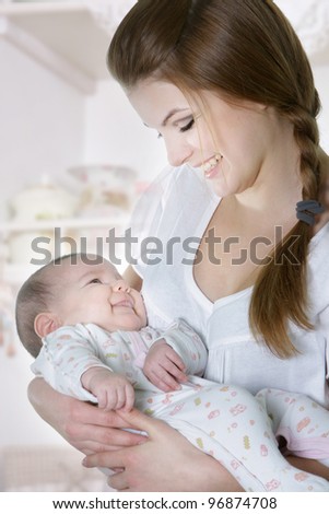 young mother with baby at home