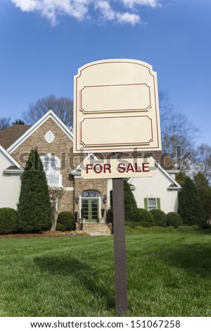 For Sale sign with copy space in front of a home