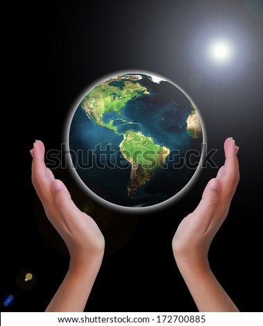 World in Hand Element of this image furnished by NASA.