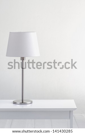 lamp on the table and blank space with white wall background