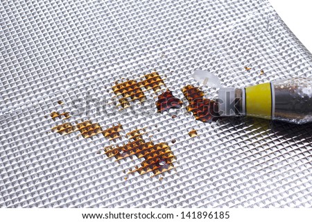 soy bean sauce stained on the foil sheet